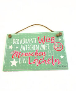 Deko Holzschild "Der kürzeste Weg zwischen zwei Menschen ist ein Lächeln" hellgrün